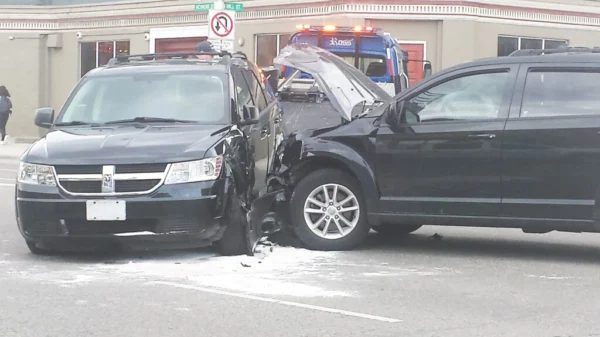 Two LAPD officers and a civilian were injured in a collision at an intersection in Los Angeles.