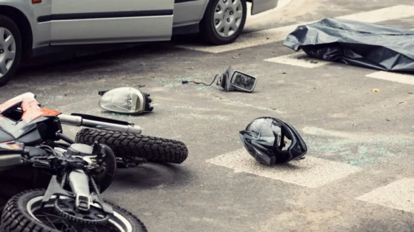 A motorcyclist was killed after being pinned between two vehicles in a Calabasas parking lot.