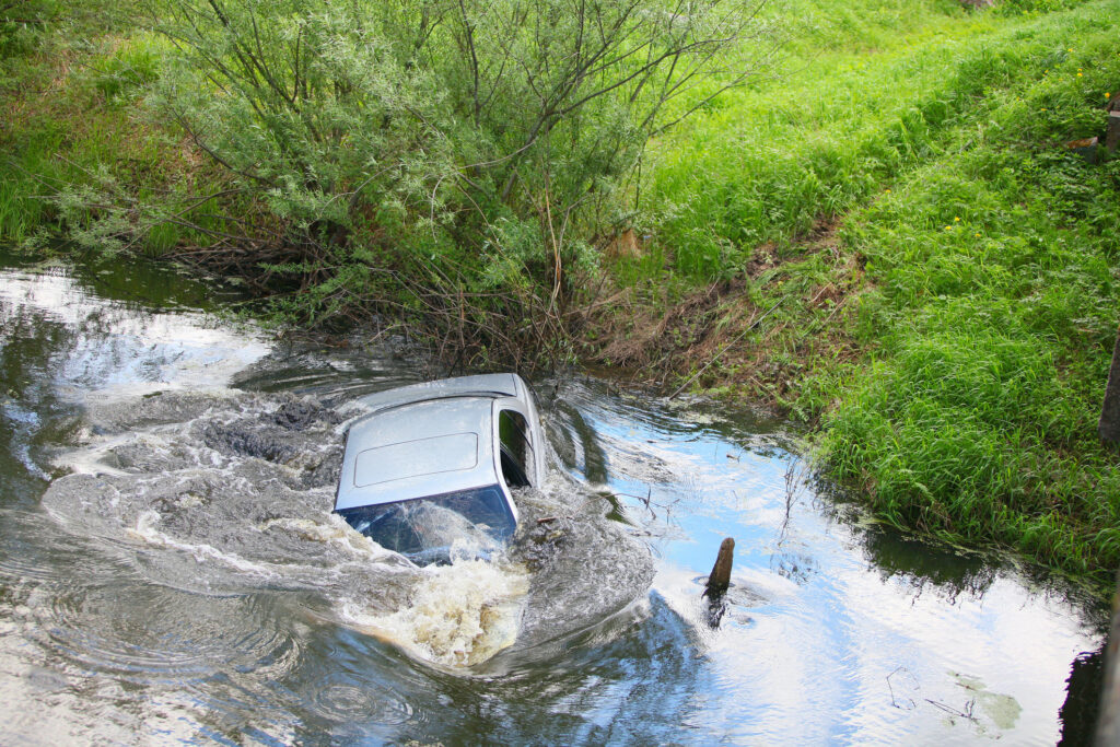 An SUV lost control and crashed into a canal near the San Gabriel River in Long Beach, killing 2.