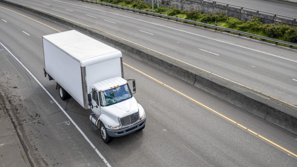 One killed in two-vehicle crash with box truck in Las Vegas.